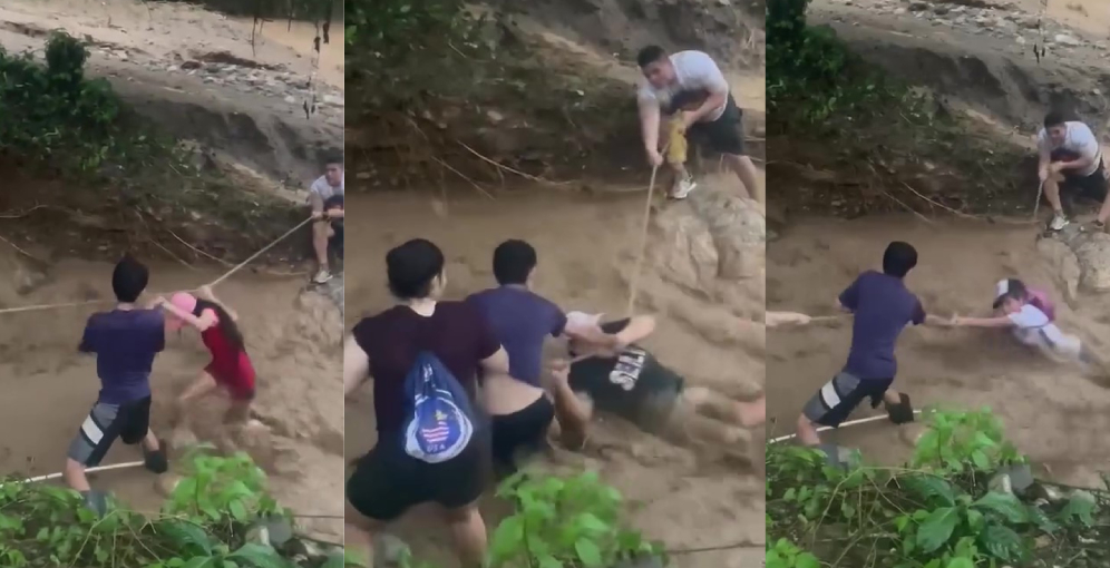Jóvenes cruzan quebrada crecida en Villanueva, Cortés.
